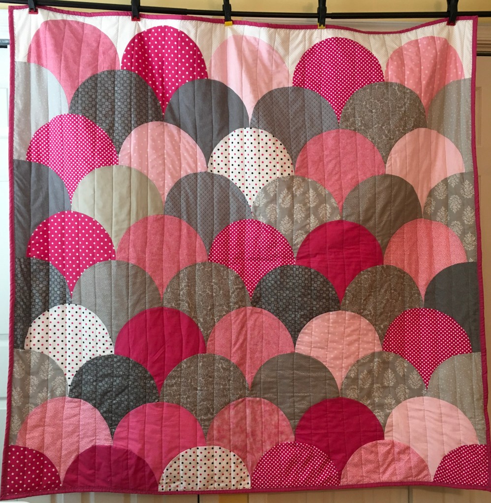 Ideal Baby quilt with flannel backing.  62 X 60 inches.